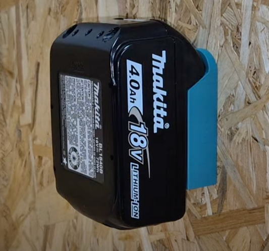 Makita battery on a wooden surface