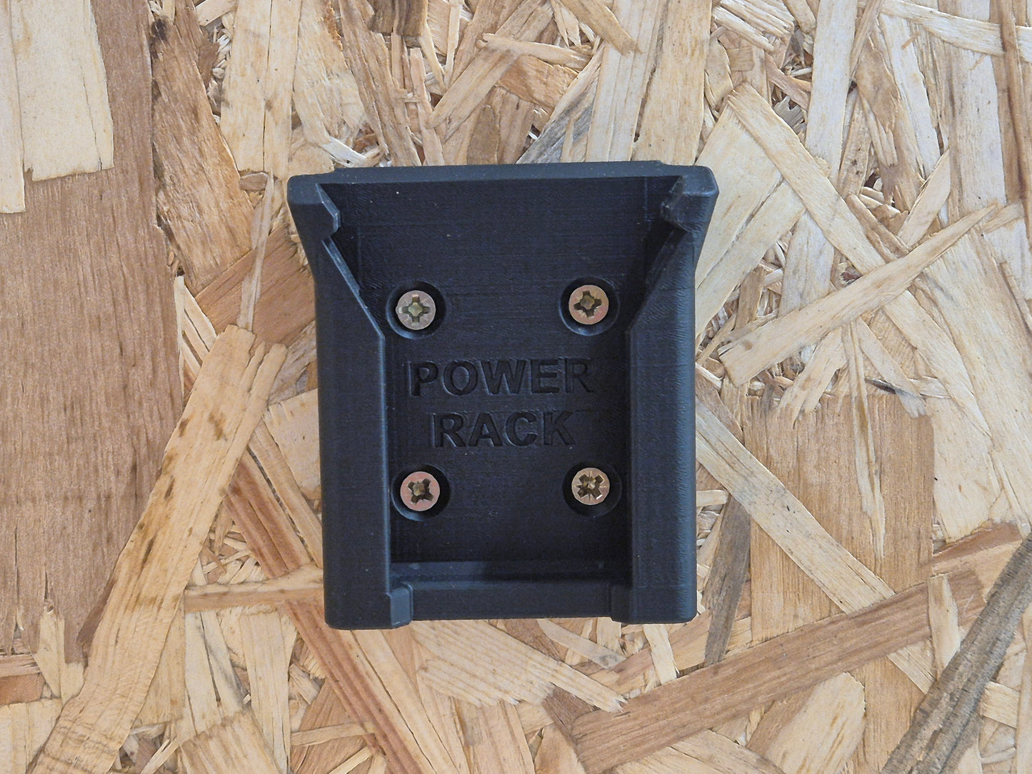 Black power rack Milwaukee Power Rack attachment on a wooden surface
