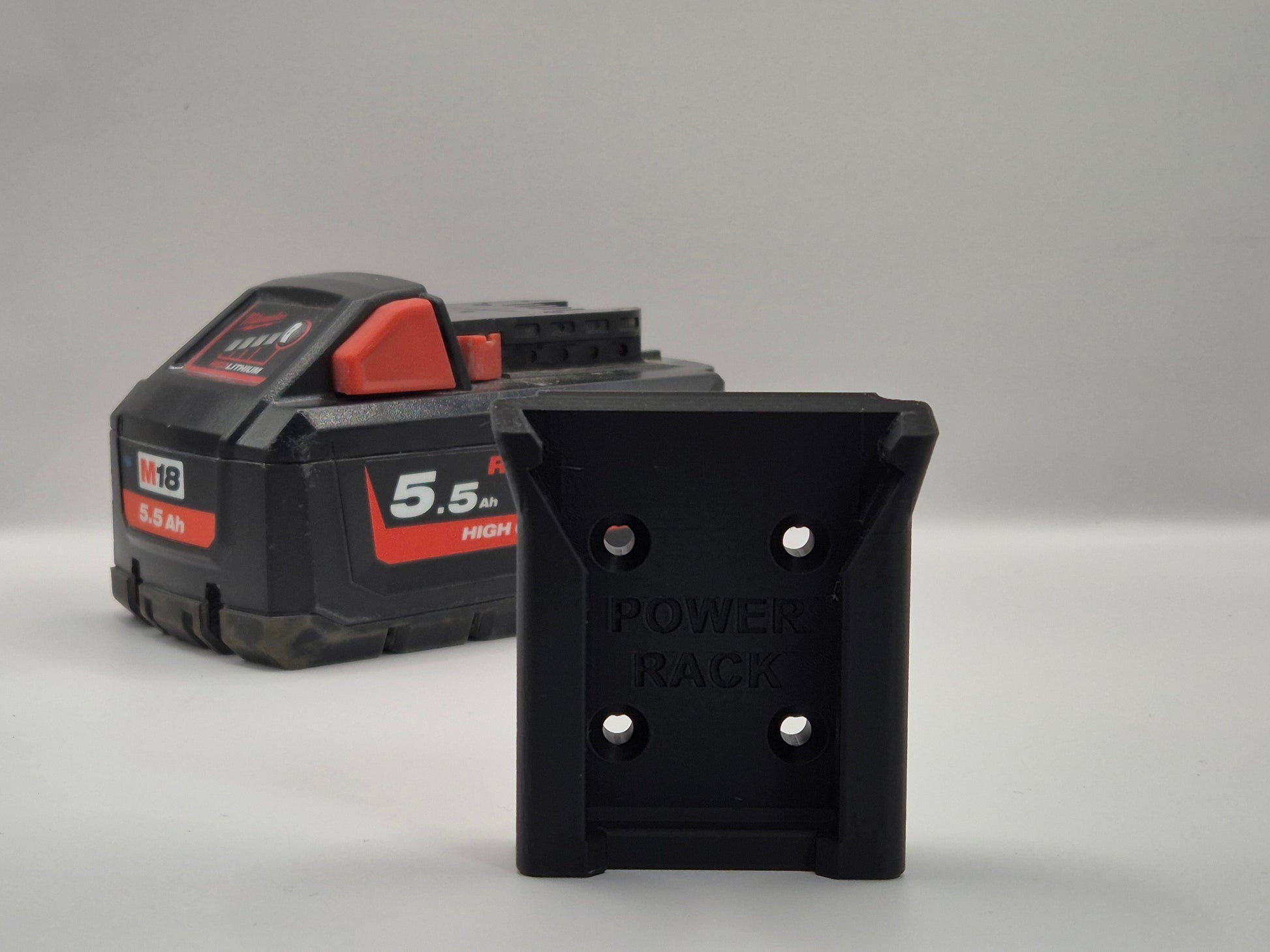Black battery pack with 'Power Rack battery Mount" branding on a grey background