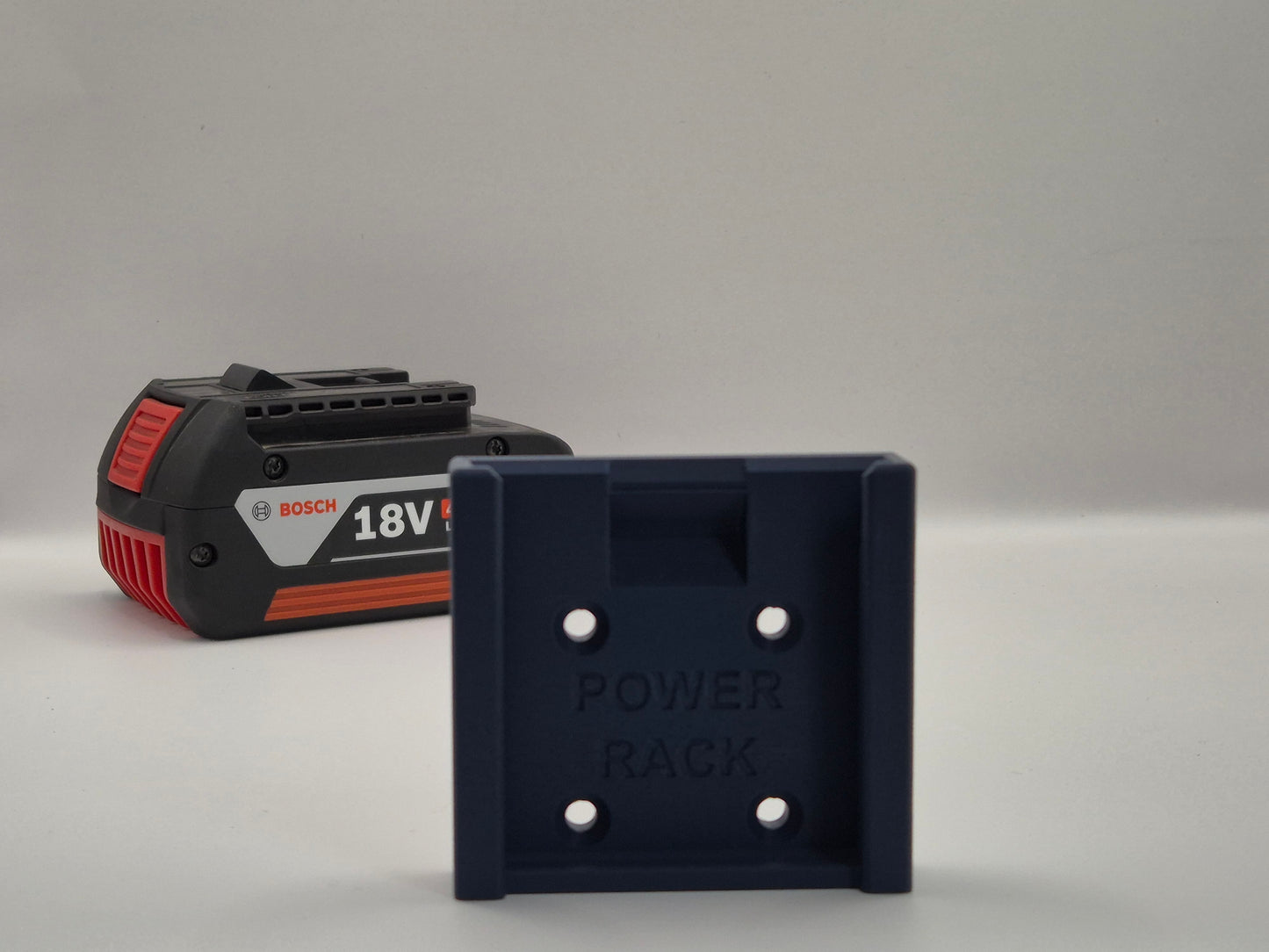 Bosch 18V battery and power rack on a grey background