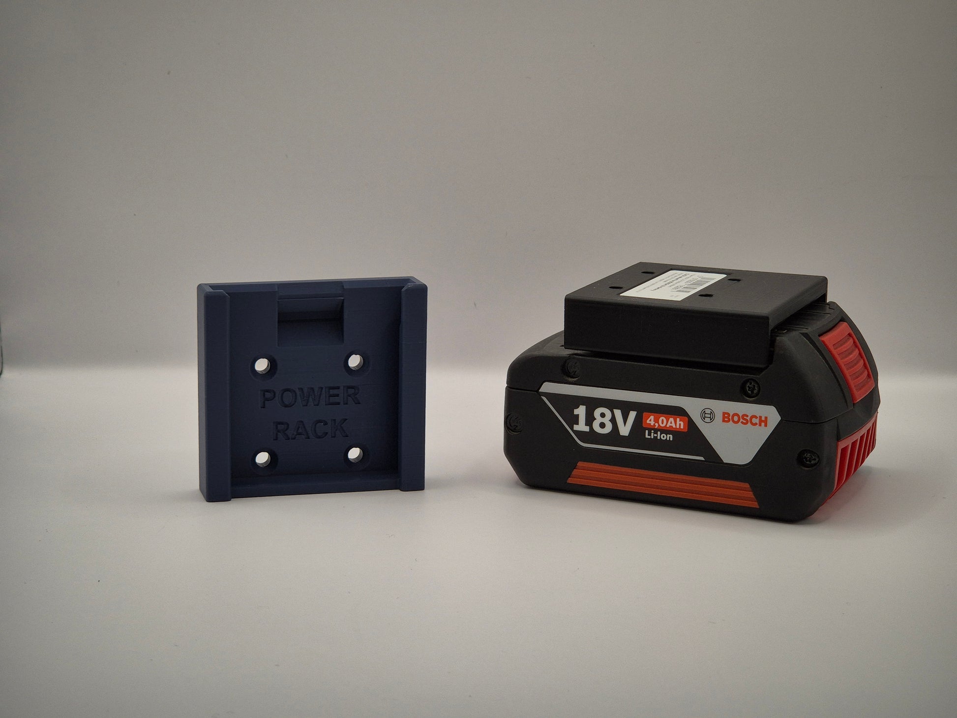 Bosch power tool battery and power rack on a grey background