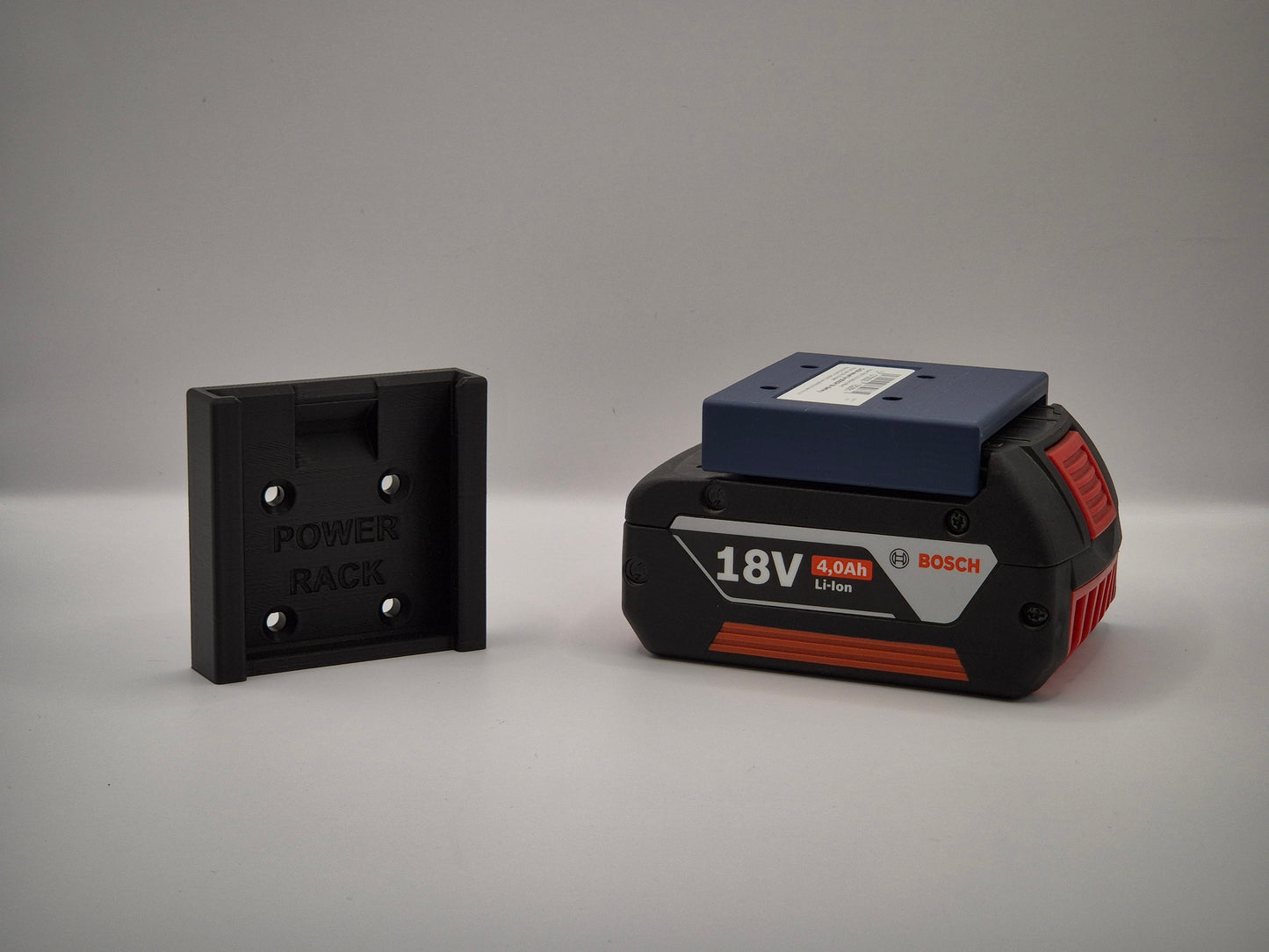 Bosch power tool battery and power rack on a gray background